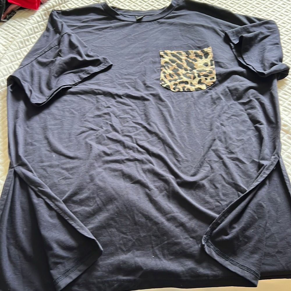 Blue t shirt with cheetah pocket, slits at bottom to make more dressy
